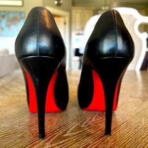 Christian Louboutin pumps.